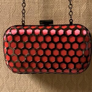 Clutch purse super small and super cute with a super long chain.